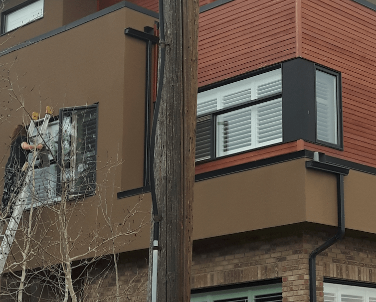 Clean Windows on Residential House High Story