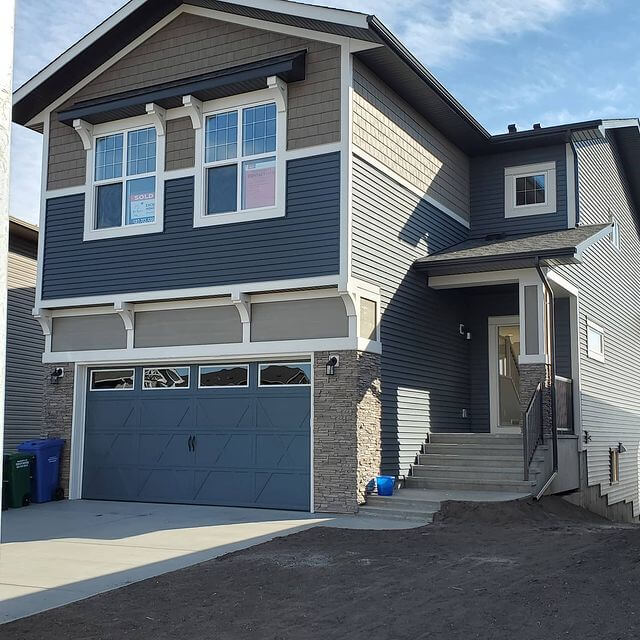 Clean Windows on Residential House Blue