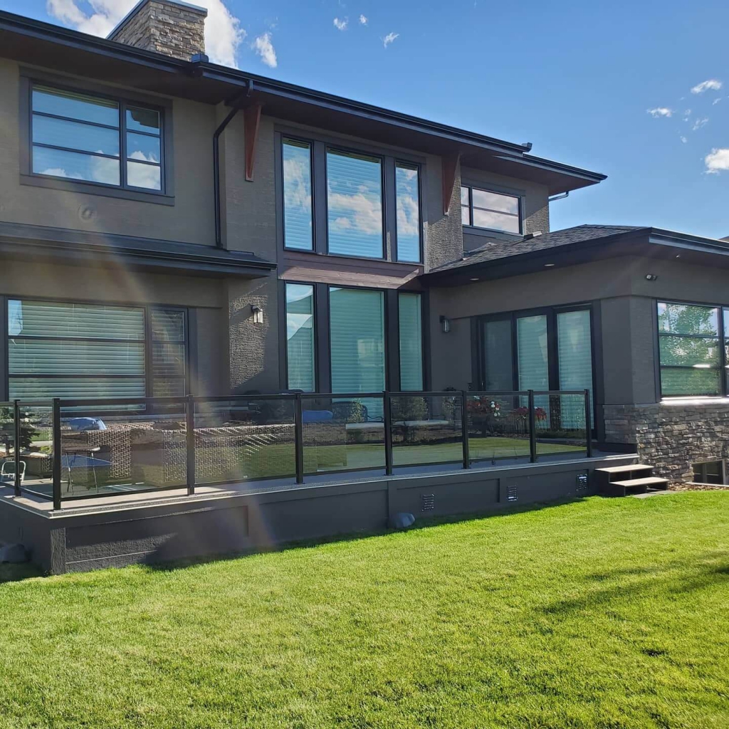 Clean Windows on Residential House With Green Backyard